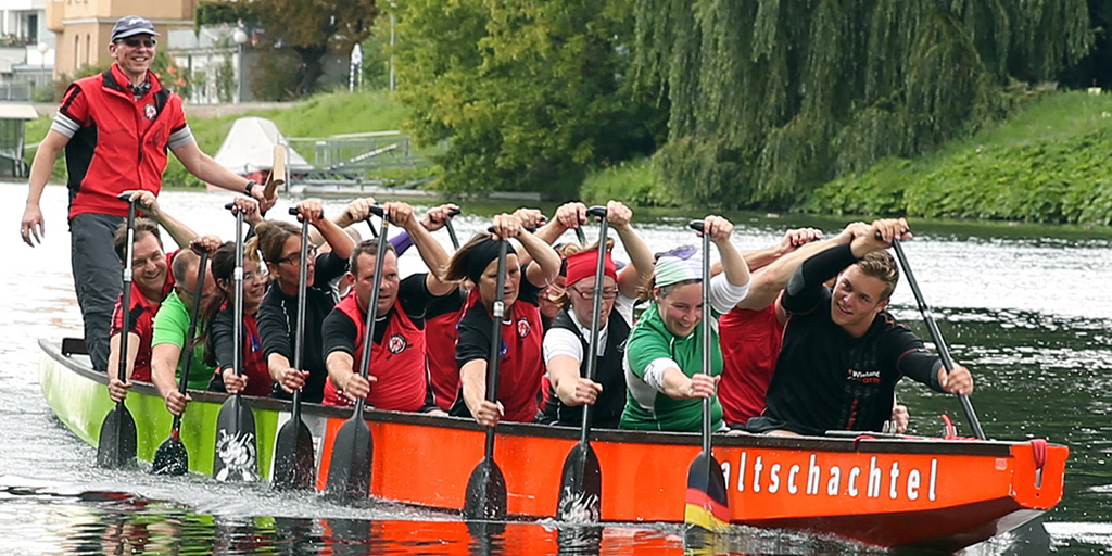 A team of rowers in a rowing boat