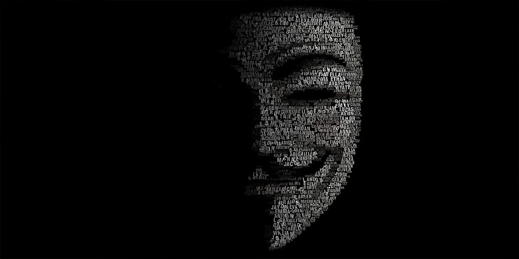 Guy Fawkes mask shrouded in darkness